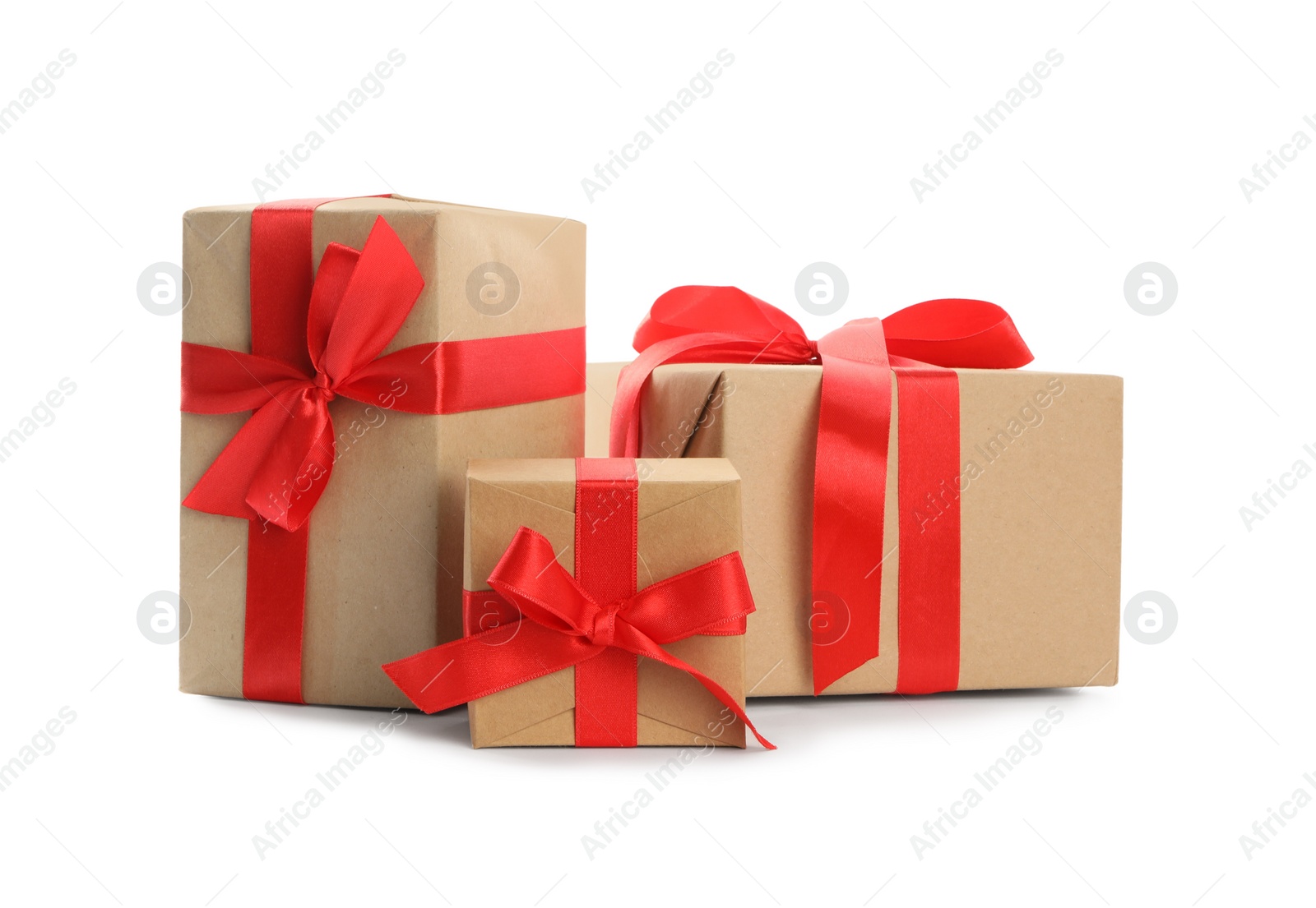Photo of Christmas gift boxes decorated with red bows on white background