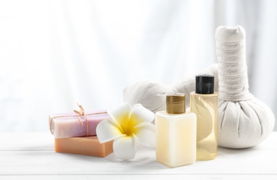 Photo of Beautiful composition with spa products on white wooden table