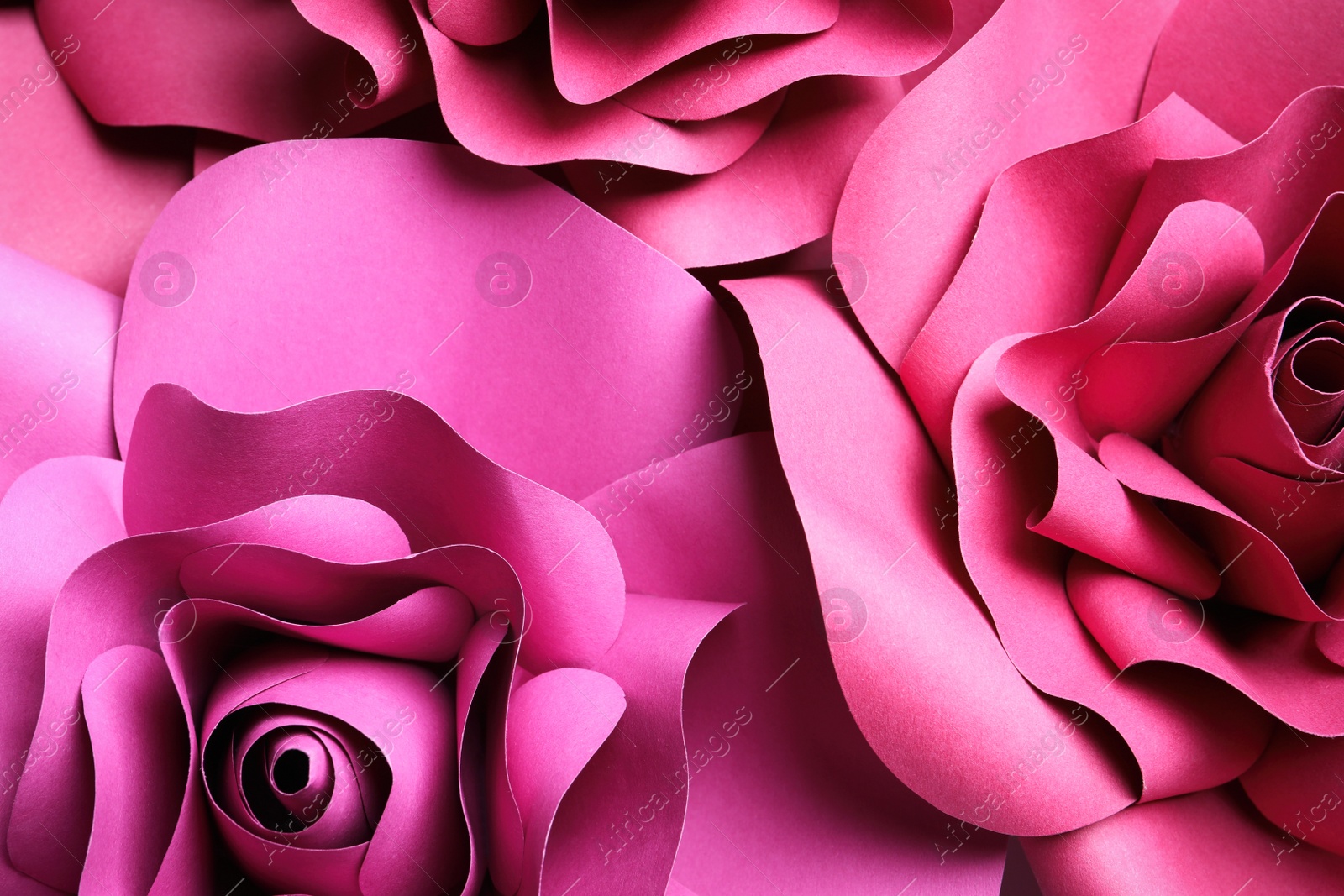 Photo of Beautiful flowers made of paper as background, top view