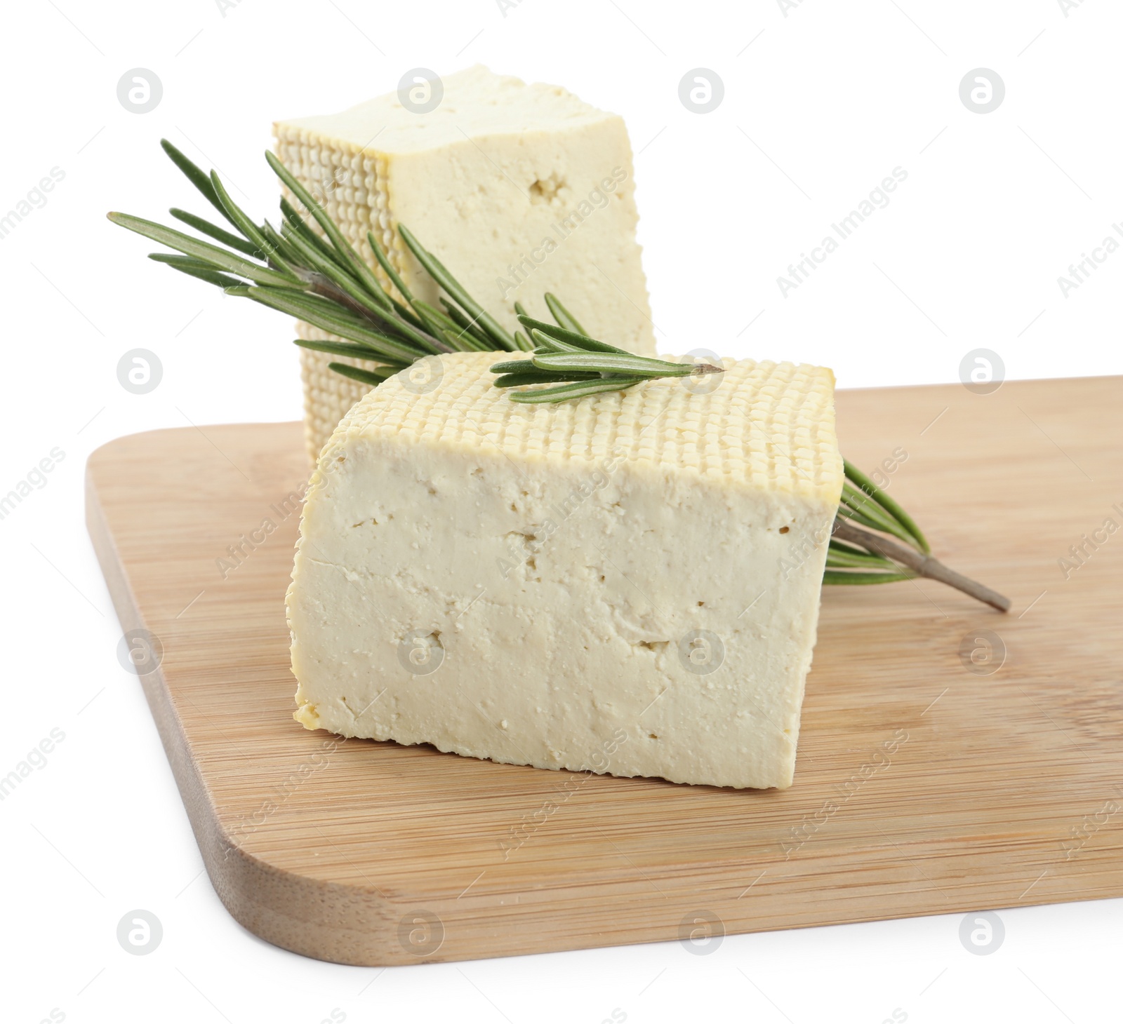 Photo of Pieces of delicious tofu with rosemary on white background. Soybean curd