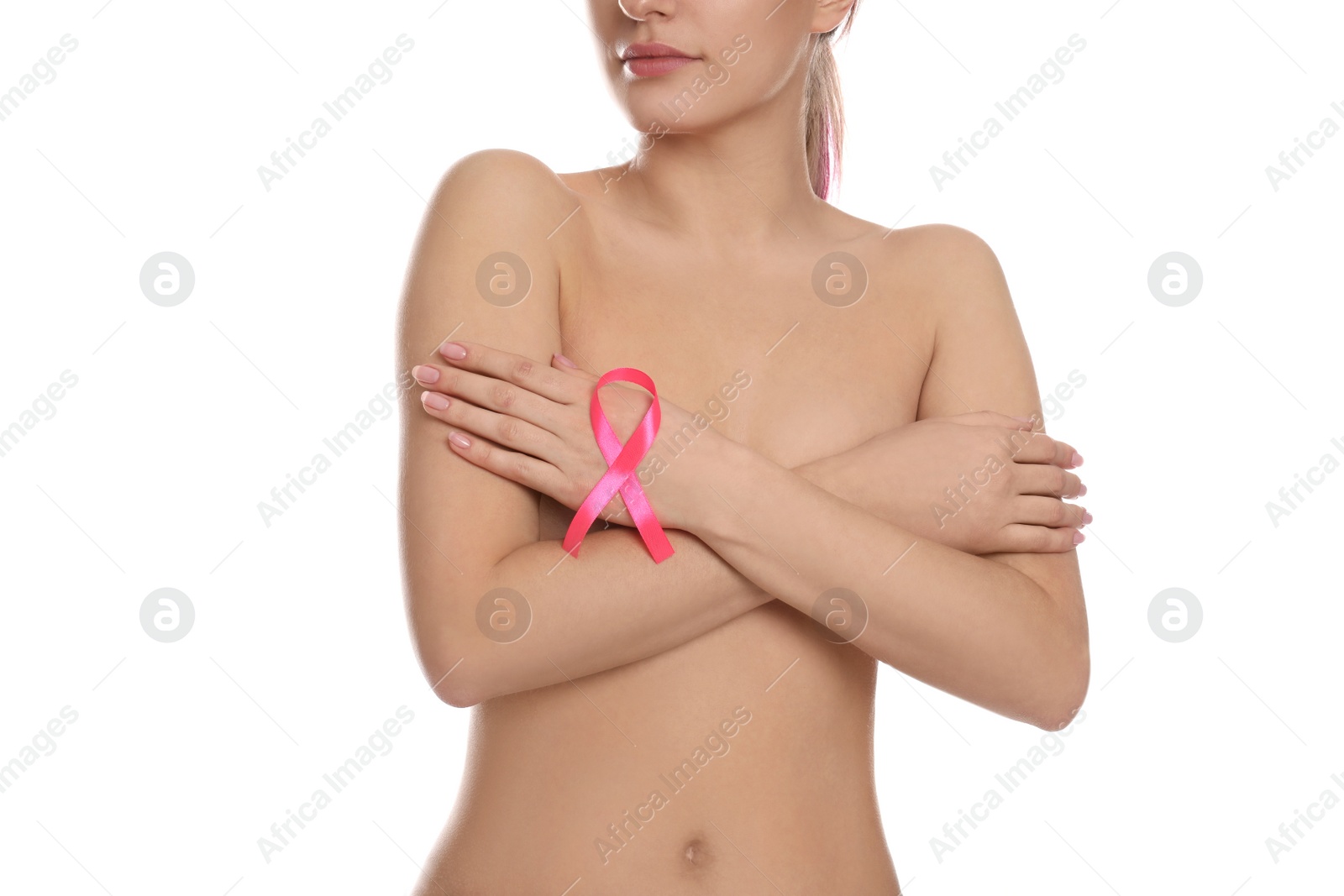 Photo of Naked woman with pink ribbon on white background, closeup. Breast cancer awareness