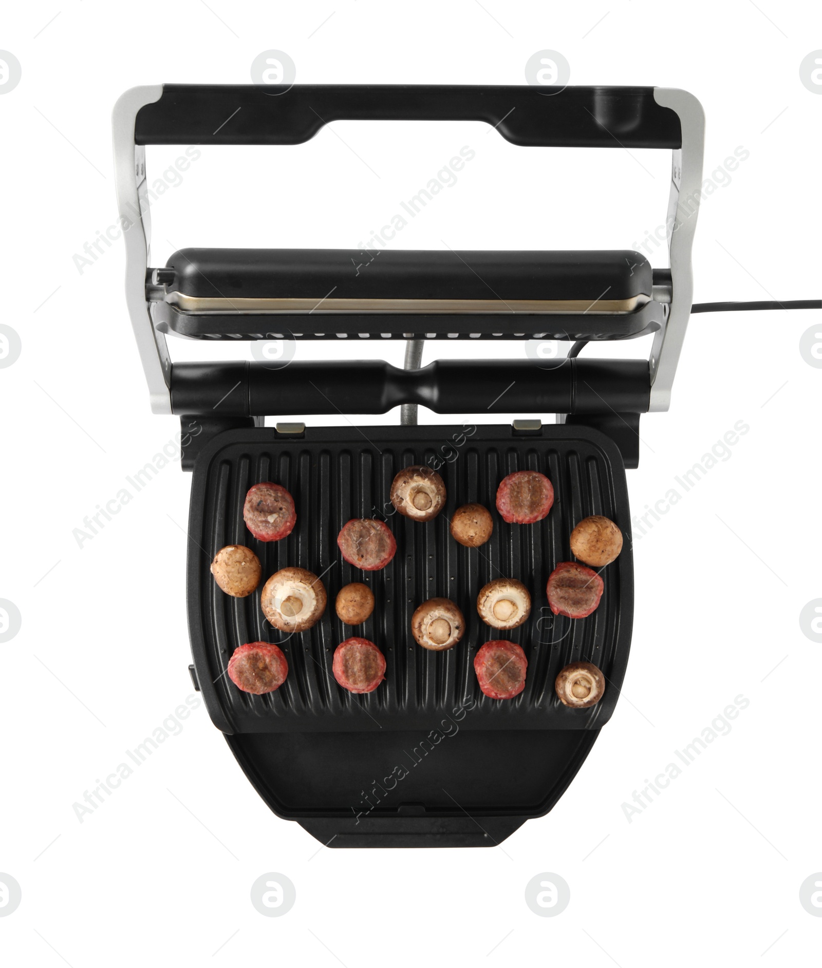 Photo of Electric grill with meat balls and mushrooms isolated on white, top view