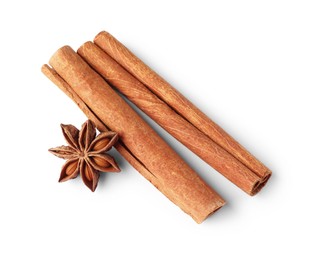 Photo of Cinnamon sticks and anise star isolated on white, above view