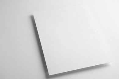 Photo of Blank paper sheet on white background. Mock up for design