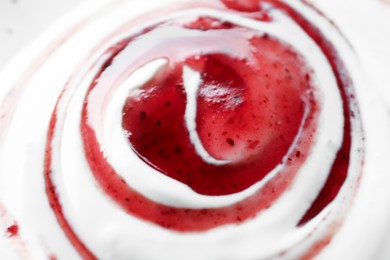 Photo of Tasty yoghurt with jam as background, closeup
