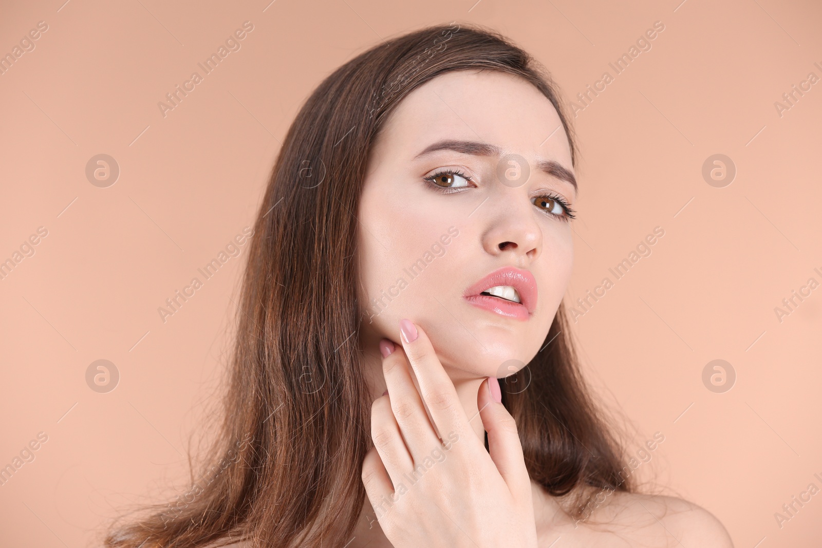 Photo of Teenage girl with acne problem against color background