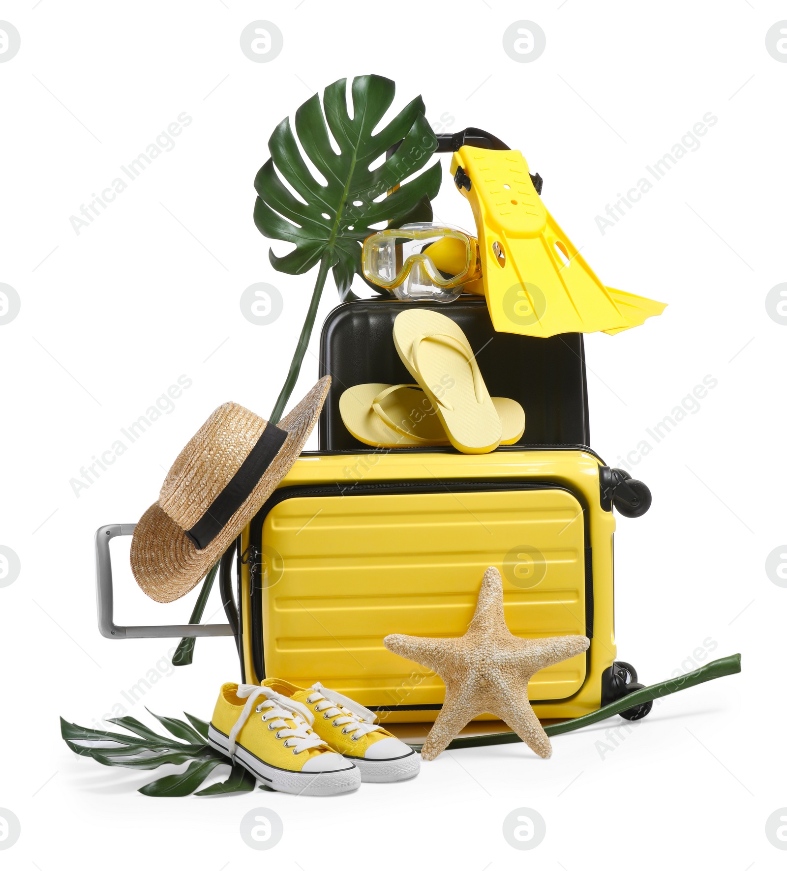 Photo of Suitcases with beach accessories and shoes isolated on white. Summer vacation
