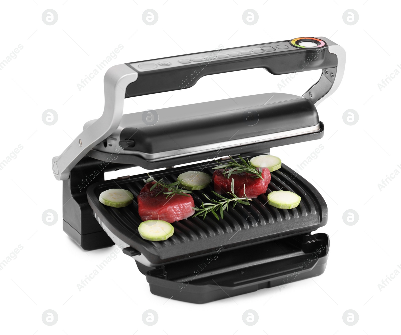 Photo of Electric grill with raw meat, zucchini and rosemary isolated on white