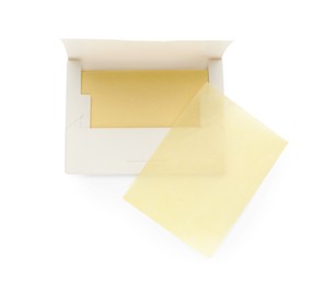 Package with facial oil blotting tissues on white background, top view. Mattifying wipes