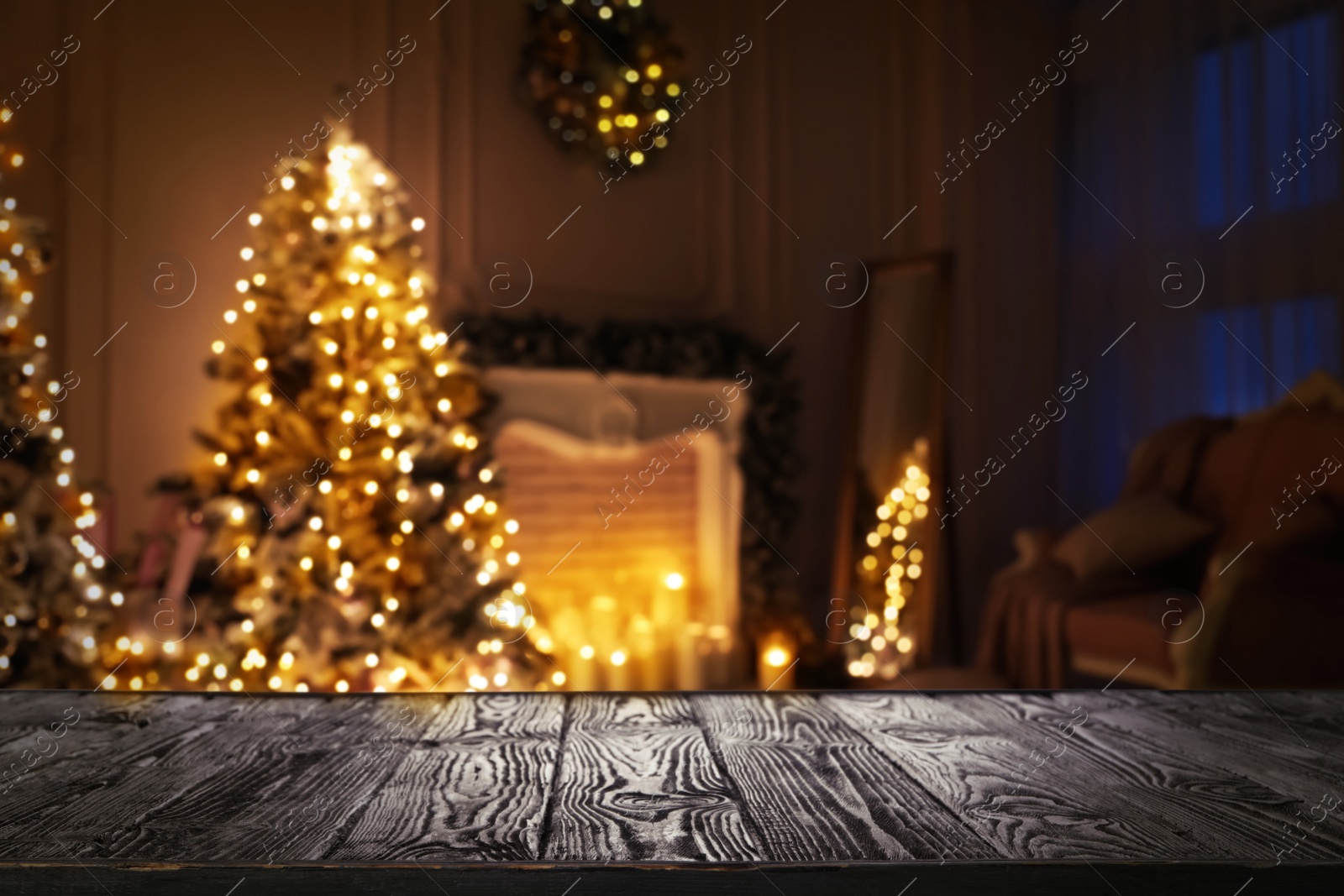 Image of Empty wooden surface and blurred view of room decorated for Christmas