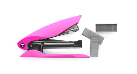 Photo of Bright pink stapler with staples isolated on white, top view