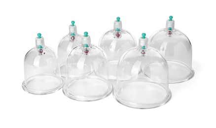 Photo of Plastic cups isolated on white. Cupping therapy