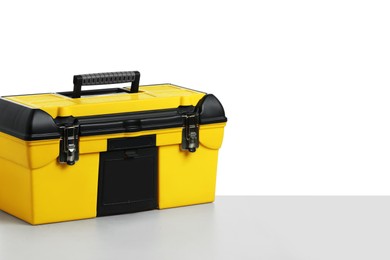 Photo of Plastic box for tools on light table against white background