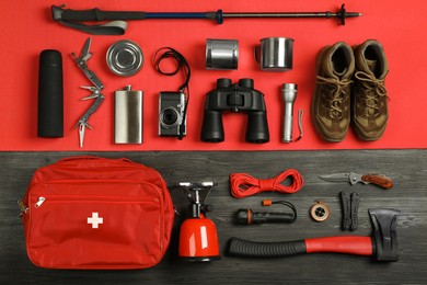 Photo of Flat lay composition with different camping equipment on color background. Traveler set