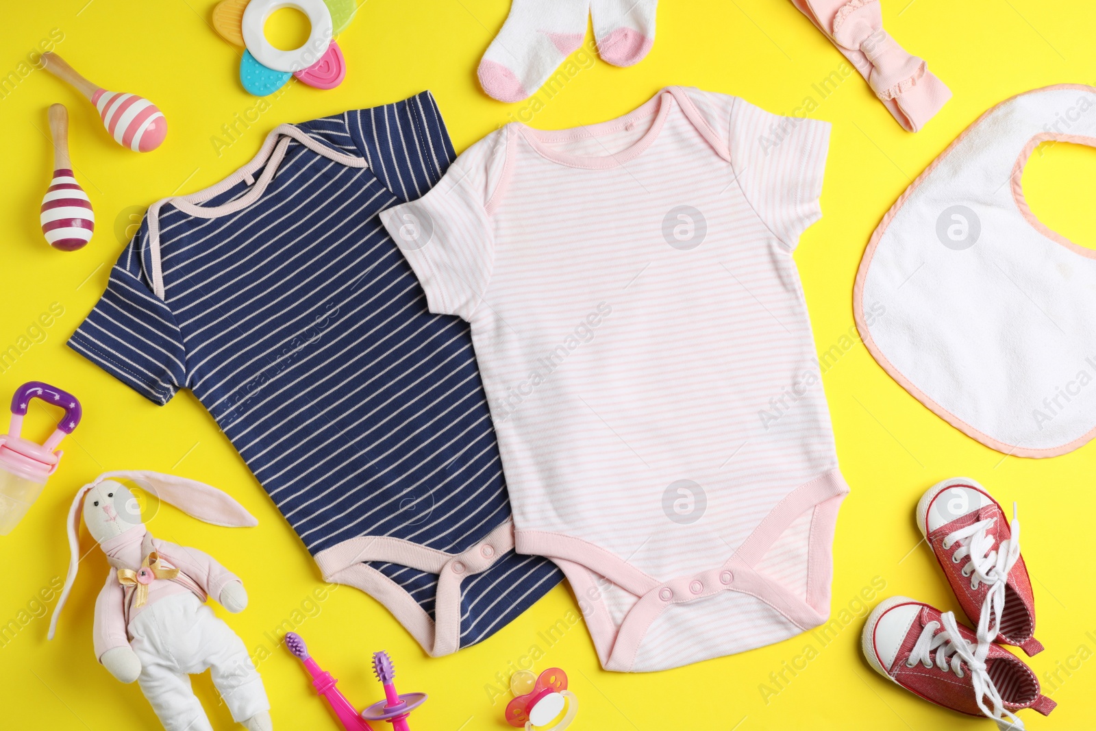 Photo of Flat lay composition with cute clothes on color background. Baby accessories