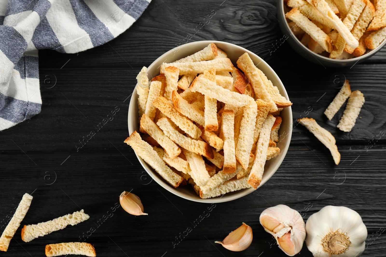 Photo of Delicious hard chucks on black wooden table, flat lay