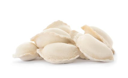 Photo of Heap of raw dumplings on white background