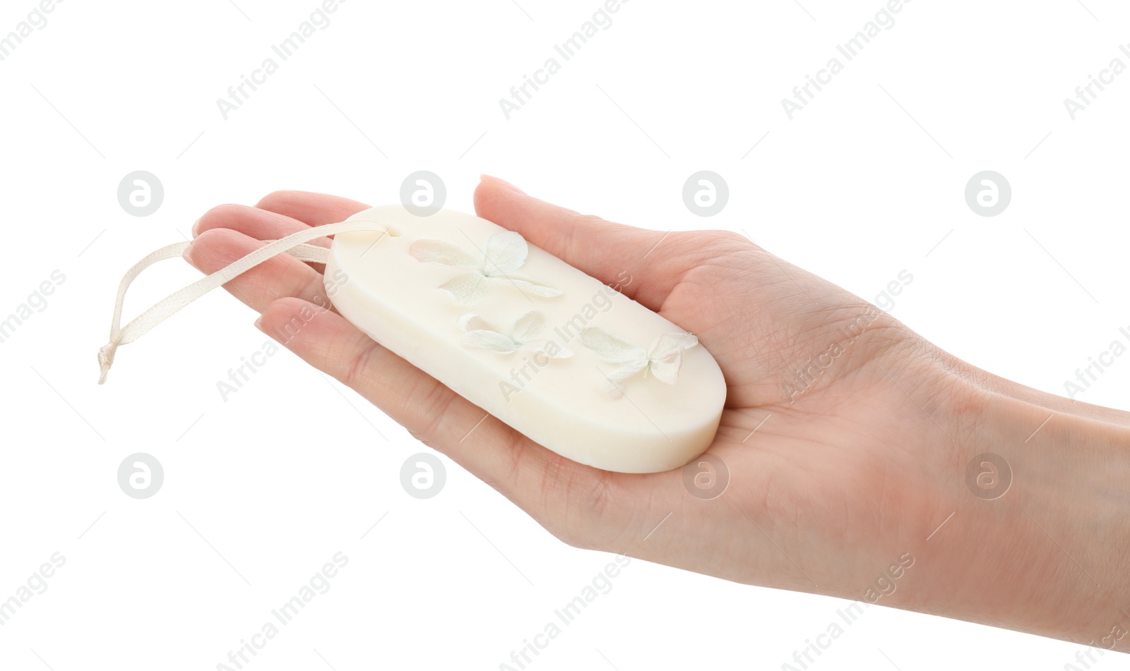 Photo of Woman holding scented sachet with flowers on white background, closeup