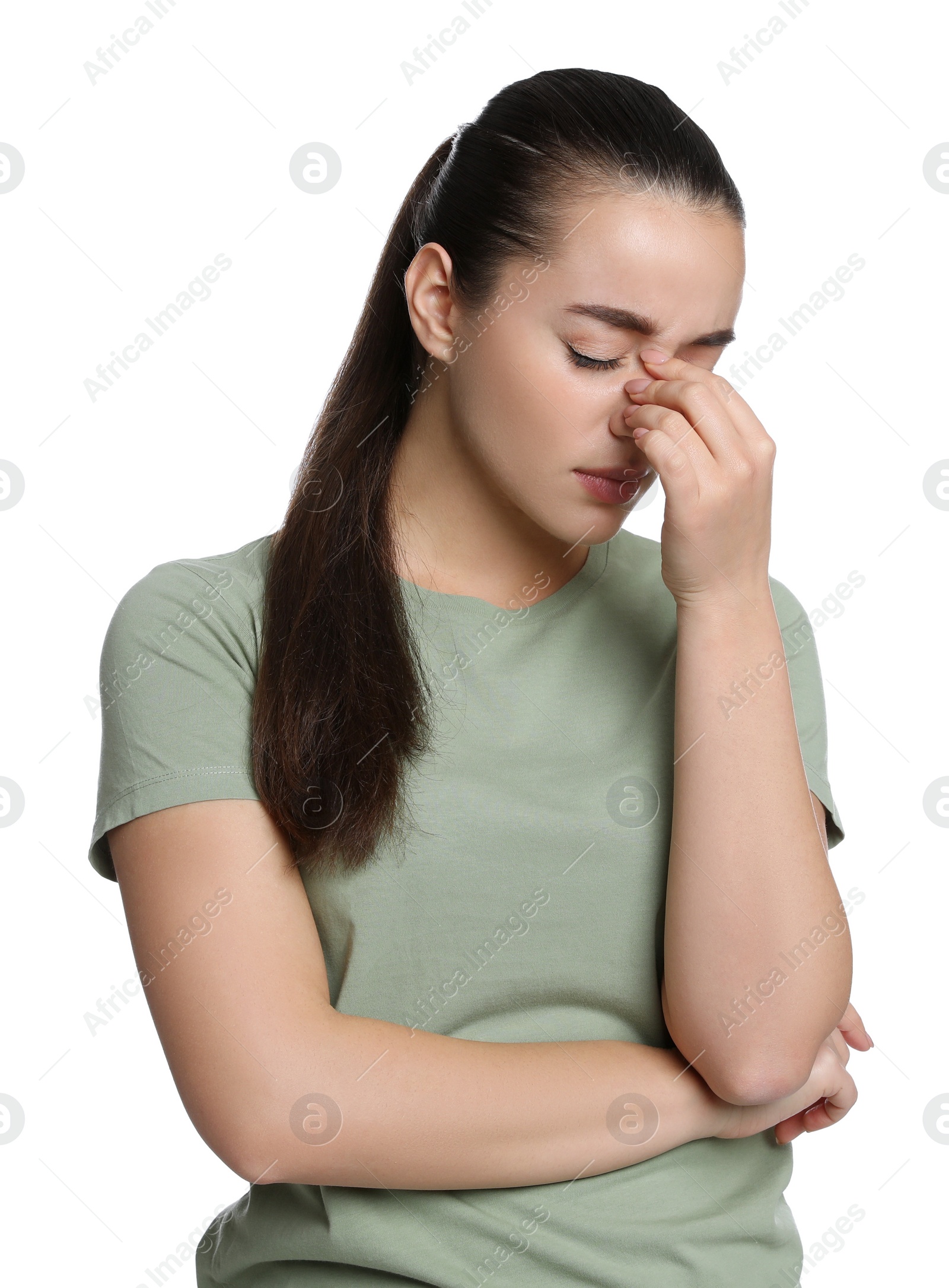 Photo of Young woman suffering from headache on white background