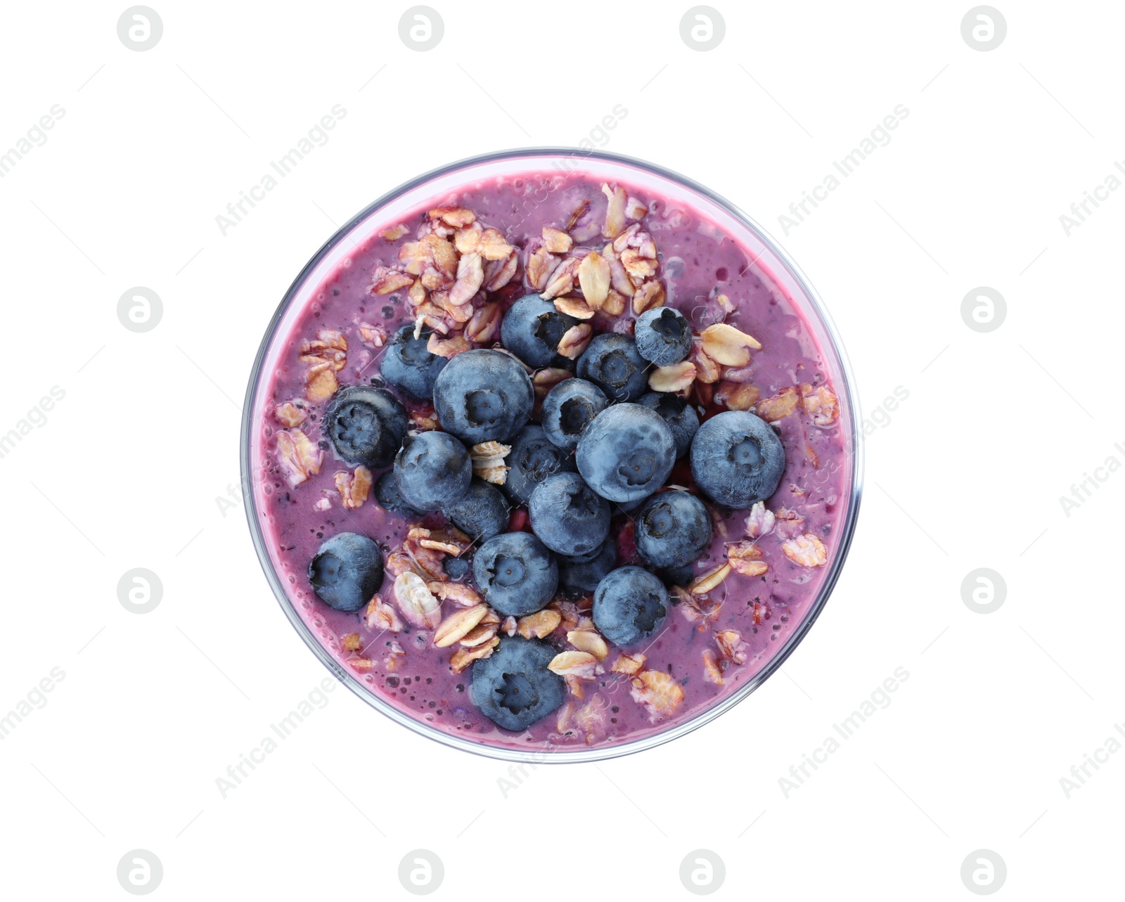 Photo of Glass of tasty blueberry smoothie with muesli on white background, top view