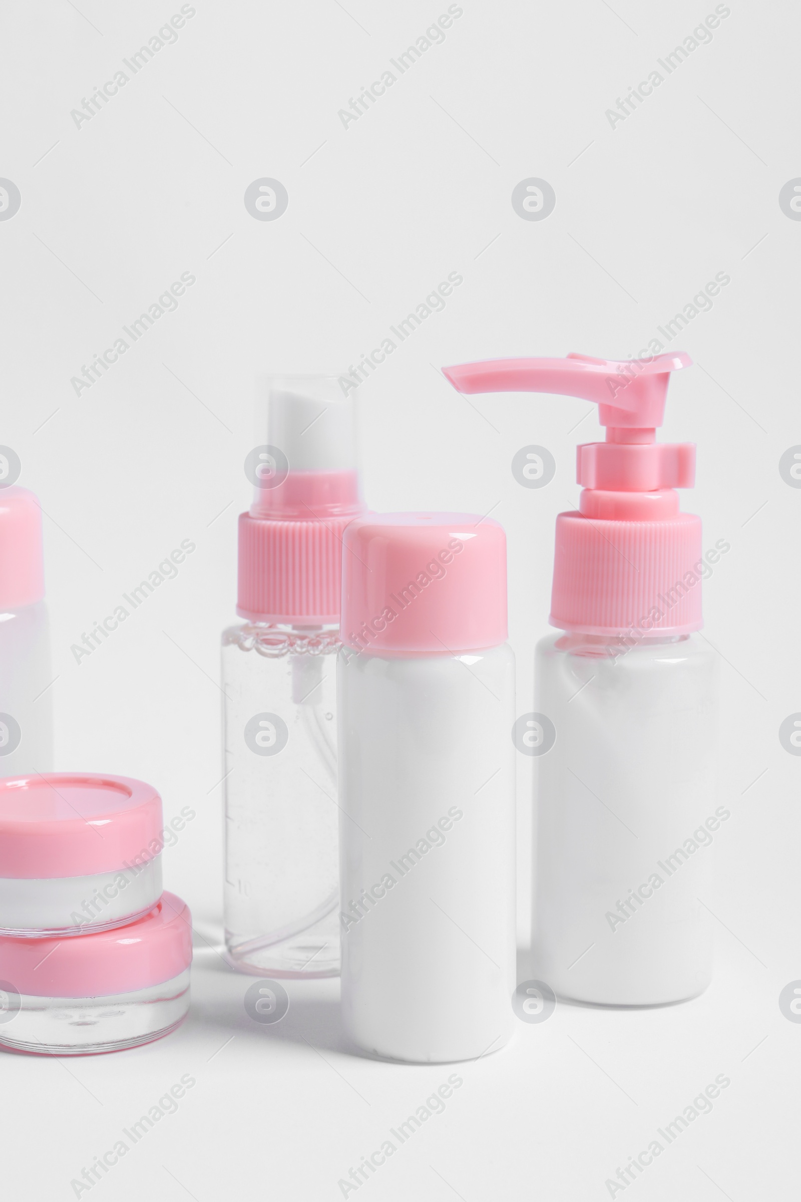 Photo of Cosmetic travel kit with personal care products on white background