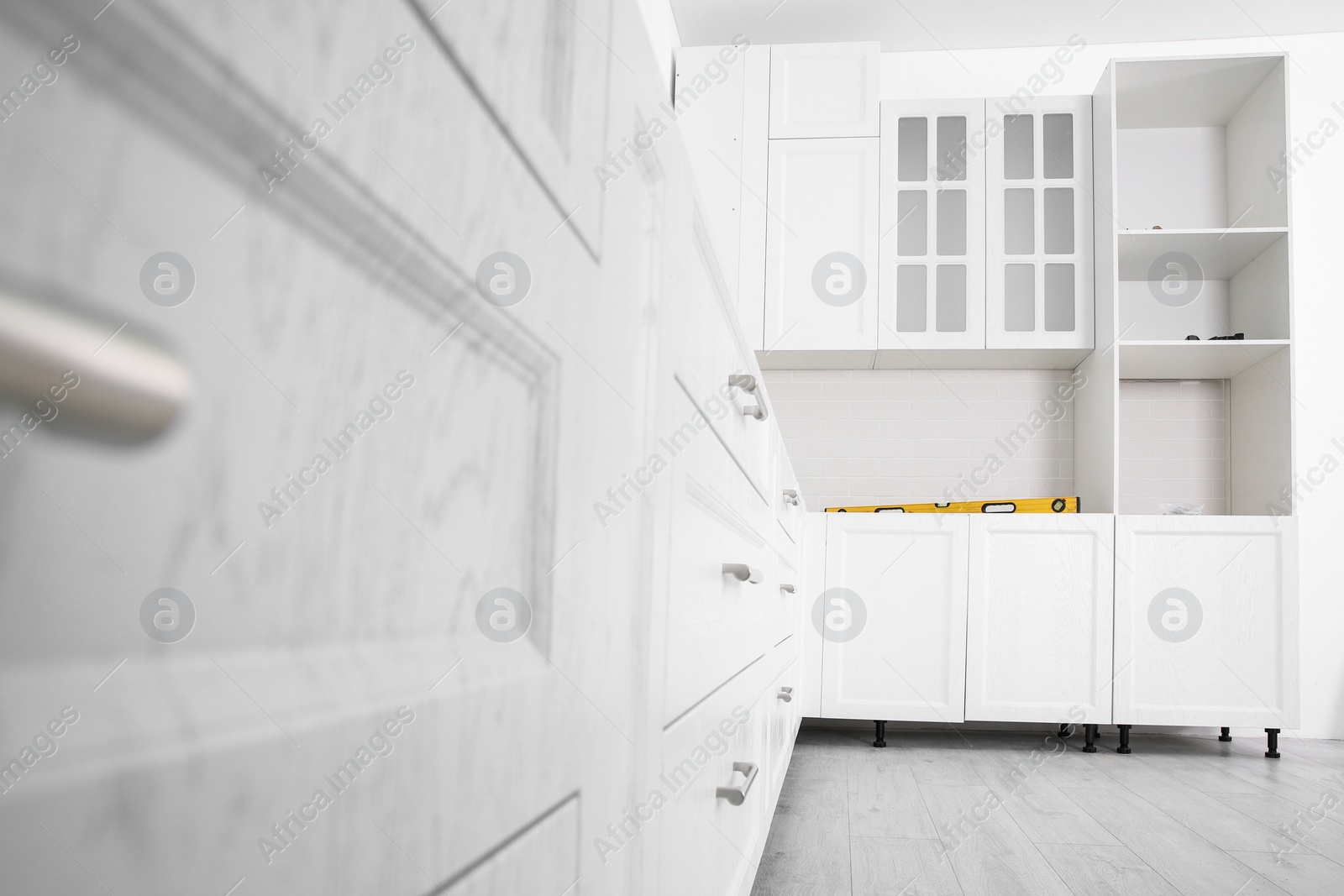 Photo of Stylish kitchen interior with newly installed furniture