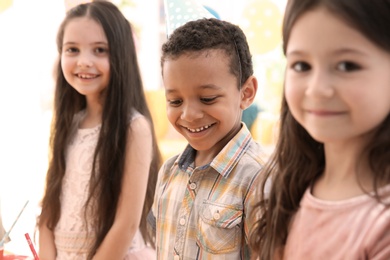 Cute little children at birthday party indoors