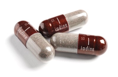 Iodine capsules on white background. Mineral element