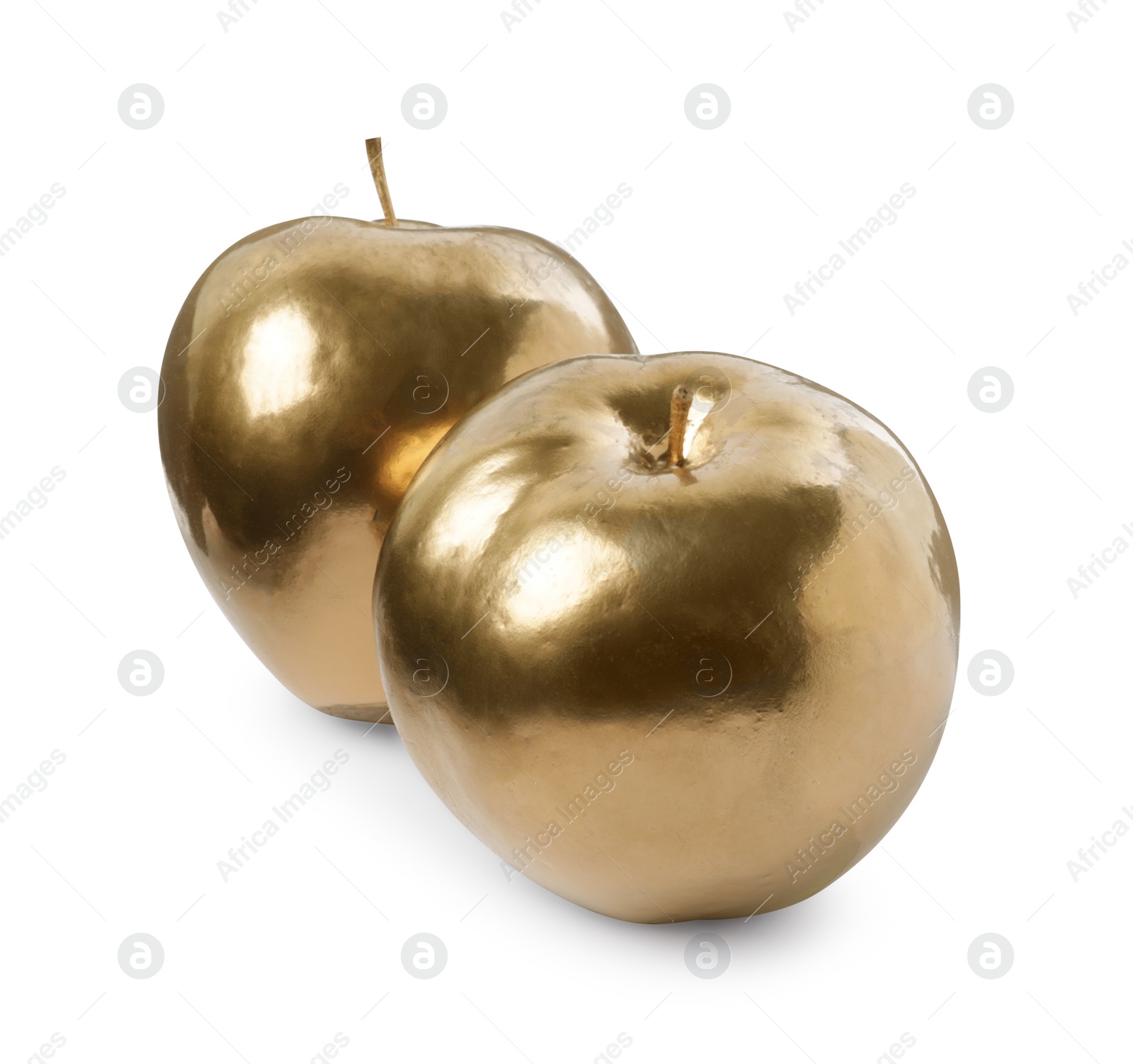 Photo of Shiny stylish golden apples on white background