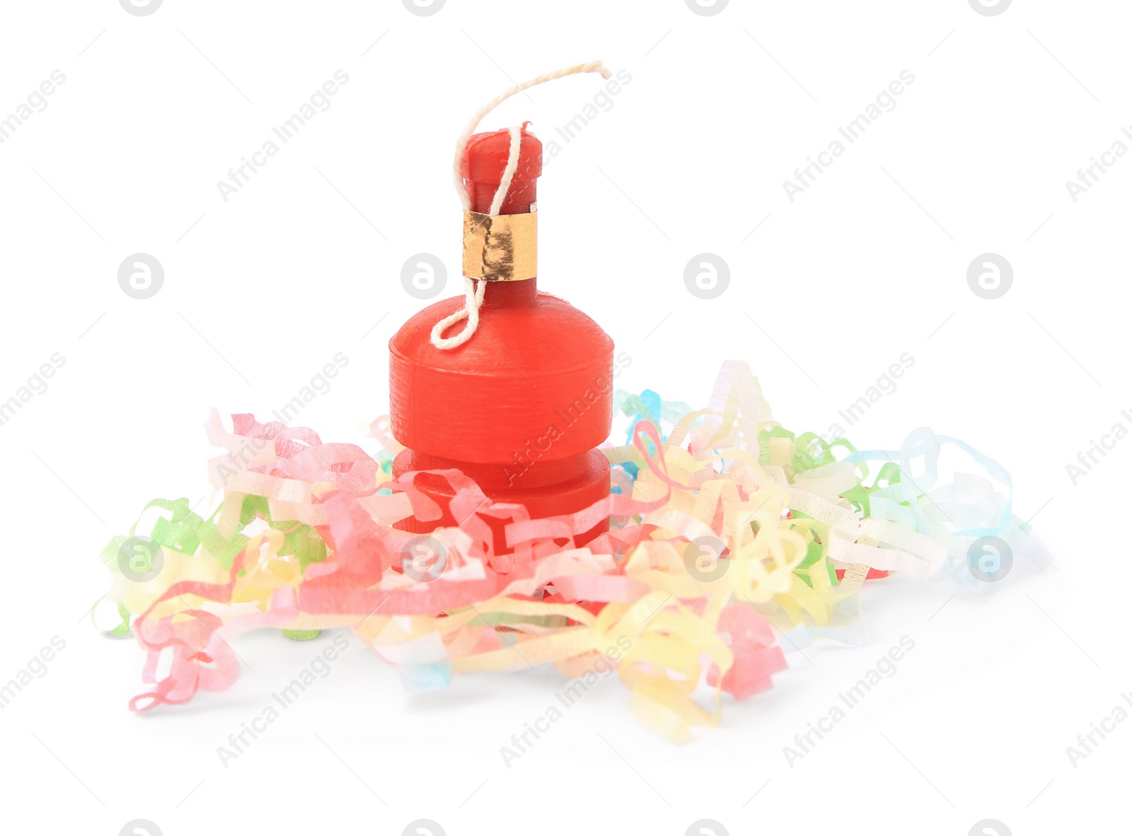 Photo of Colorful streamers with red party cracker isolated on white