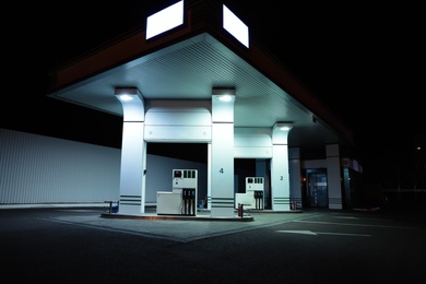 Photo of View of modern gas station at night outdoors