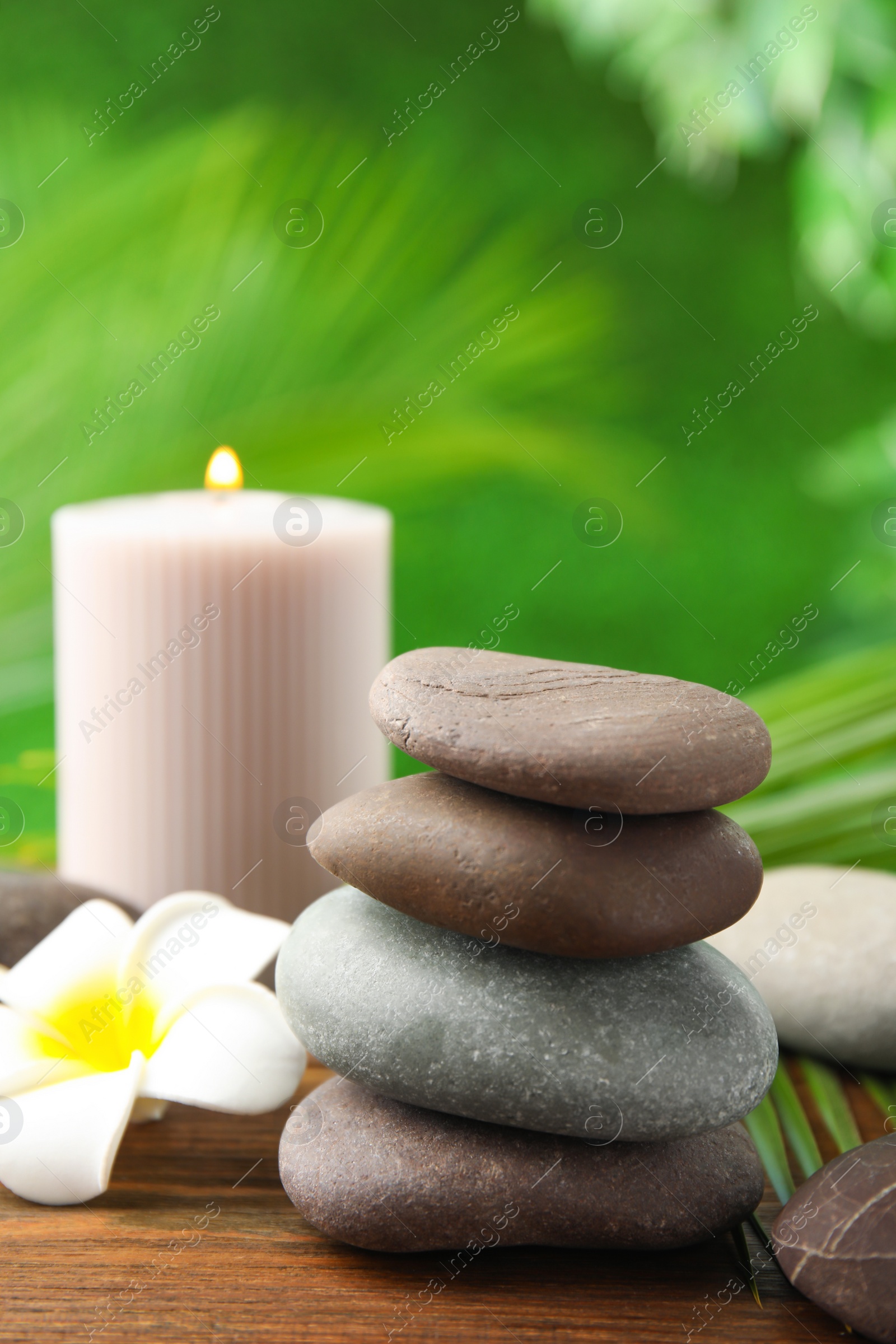 Photo of Composition with stones on table against blurred background. Zen concept