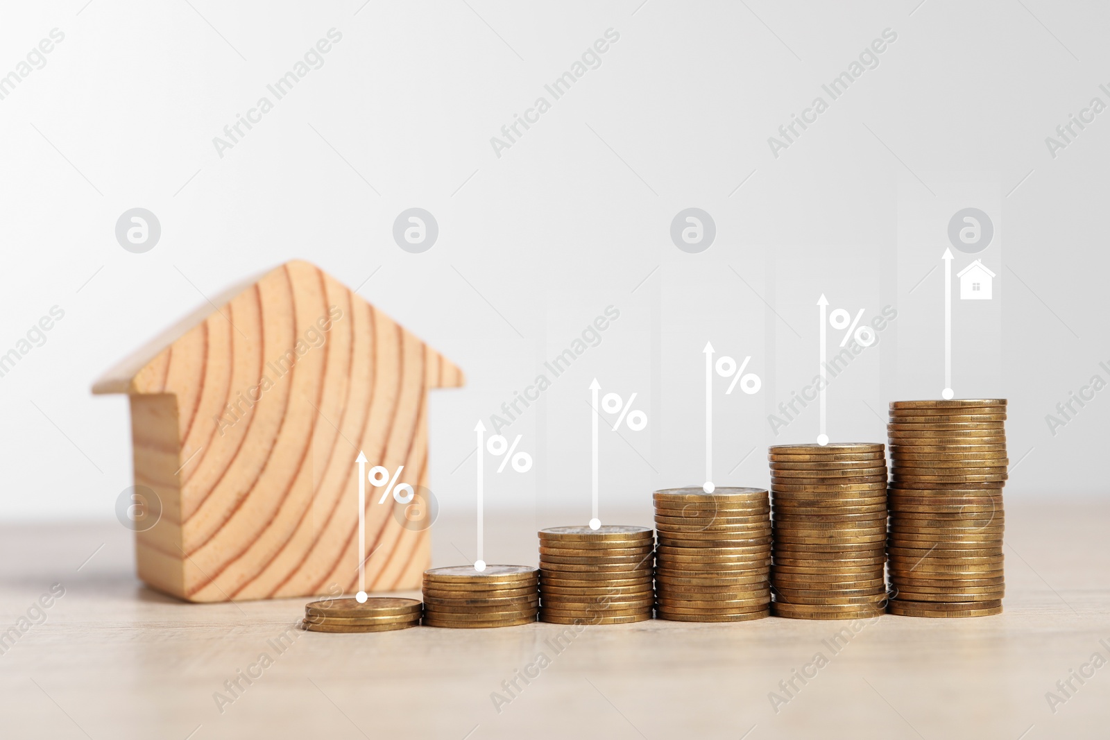 Image of Mortgage rate. Stacked coins, arrows, percent signs and model of house