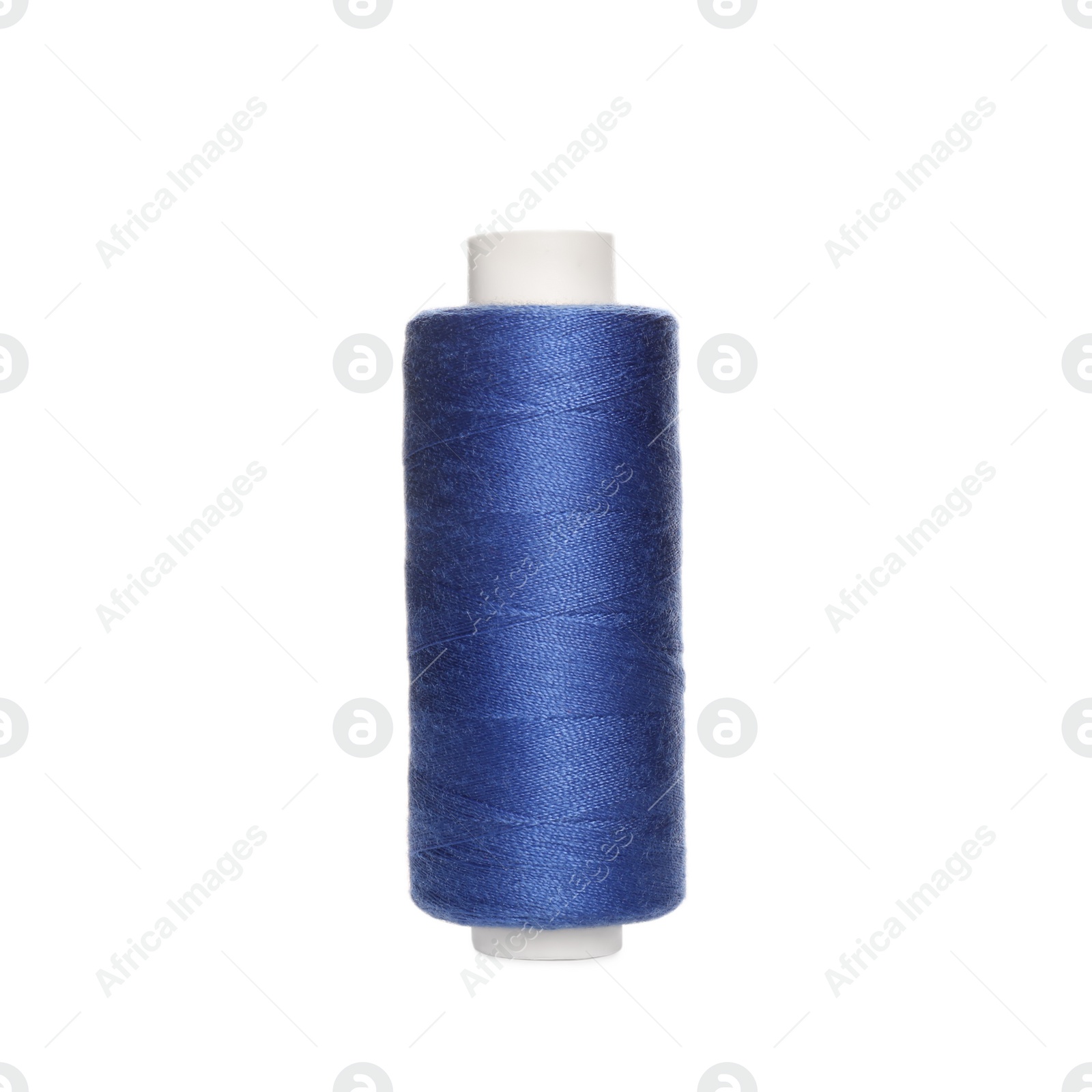 Photo of Spool of blue sewing thread isolated on white