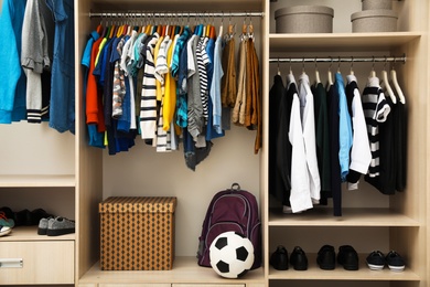 Photo of Large wardrobe with teenager clothes, shoes and accessories