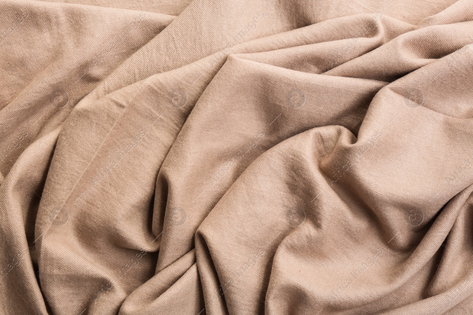 Photo of Light brown cloth as background, closeup view