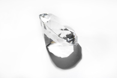 Photo of One beautiful shiny diamond on white background, top view