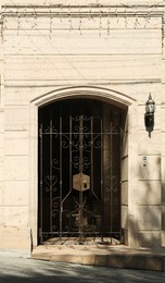 Entrance of building with beautiful old black gates