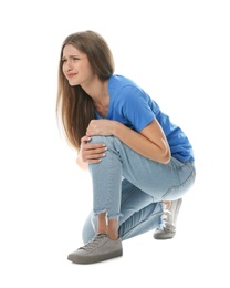 Photo of Full length portrait of woman having knee problems on white background