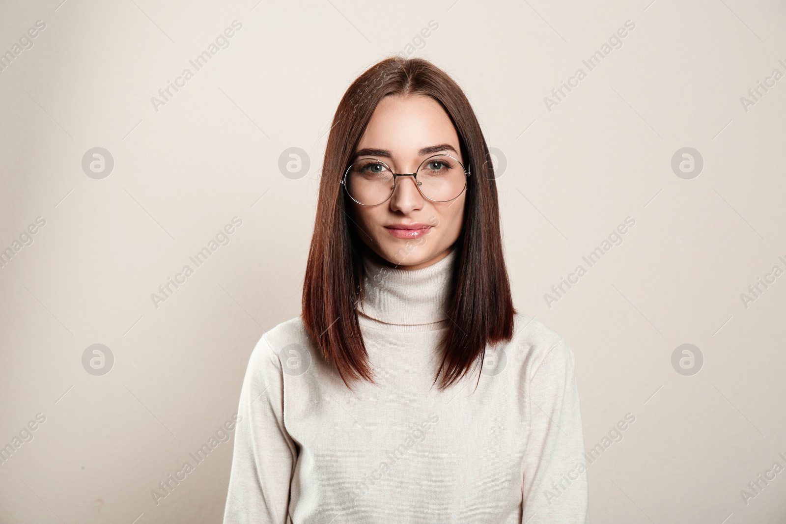Photo of Portrait of pretty young woman with gorgeous chestnut hair on light background