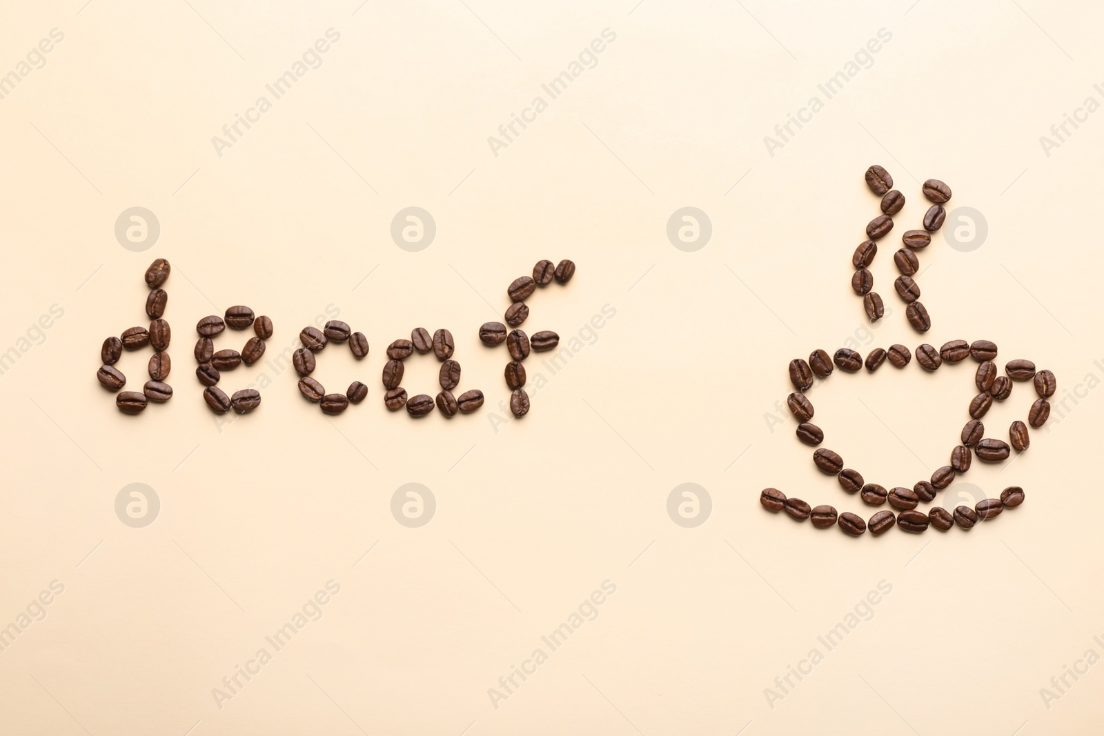 Photo of Cup of coffee and word Decaf made with beans on beige background, flat lay