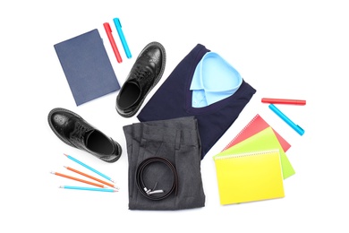 Photo of Stylish school uniform and stationery on white background, top view