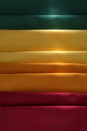 Photo of Different colorful napkins as background, top view