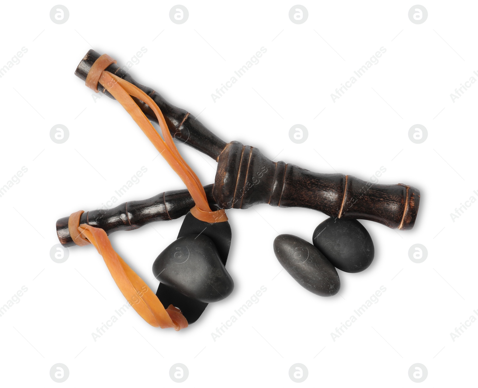 Photo of Black wooden slingshot with stones on white background, top view