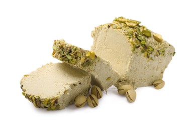 Photo of Pieces of tasty halva with pistachios on white background