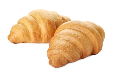 Photo of Two delicious fresh croissants isolated on white