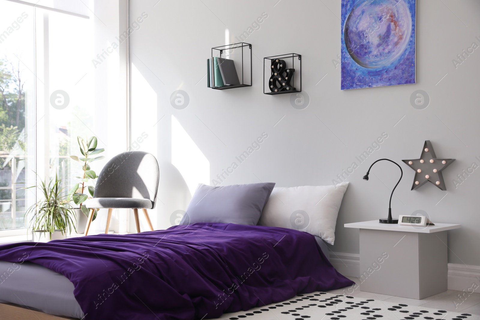 Photo of Modern teenager's room interior with comfortable bed and stylish design elements