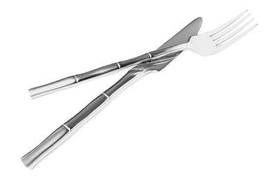 Photo of Fork and knife isolated on white. Stylish shiny cutlery set