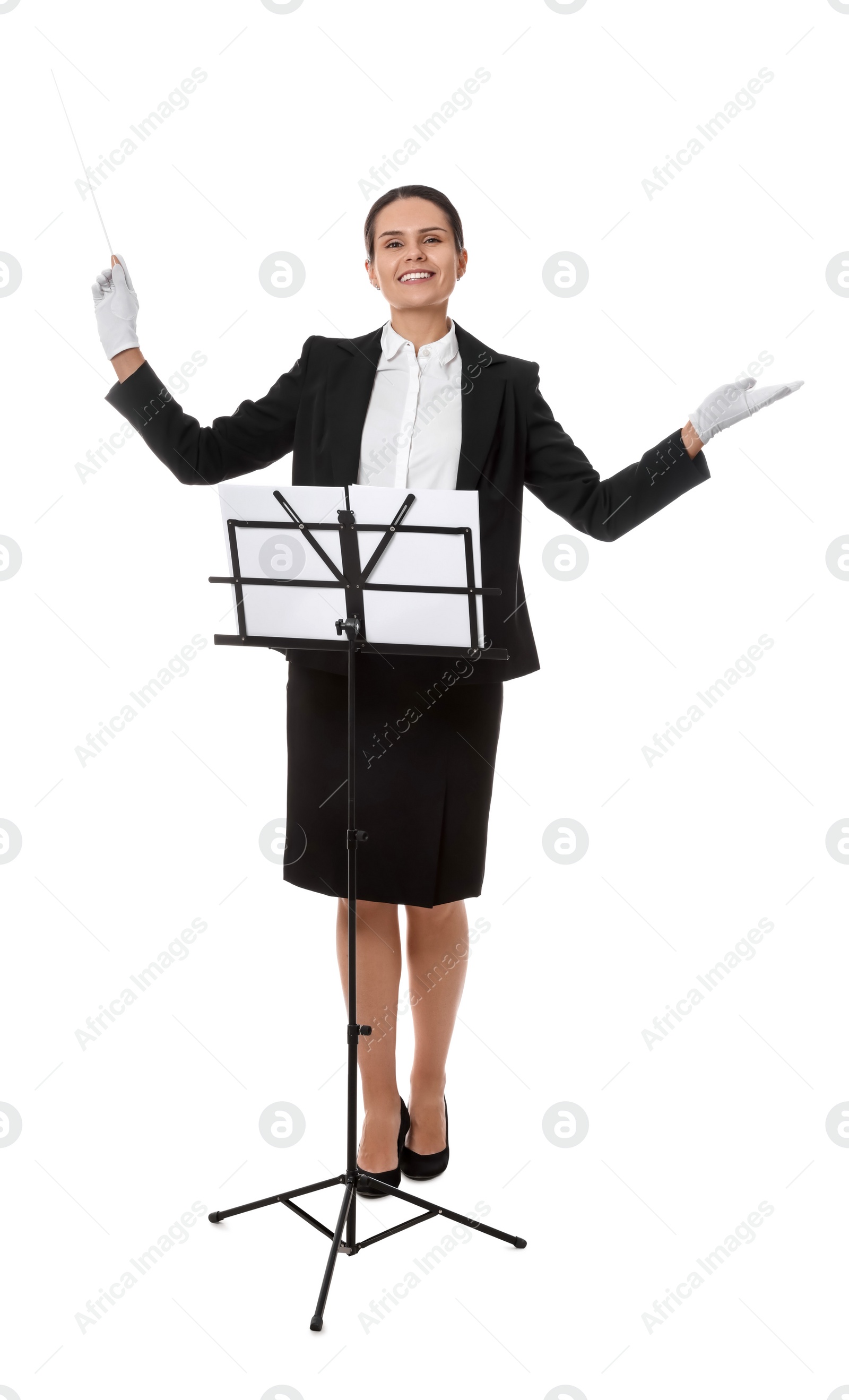 Photo of Happy young conductor with baton and note stand on white background