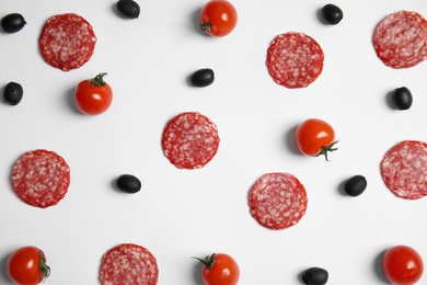 Flat lay composition with ingredients for pizza on white background